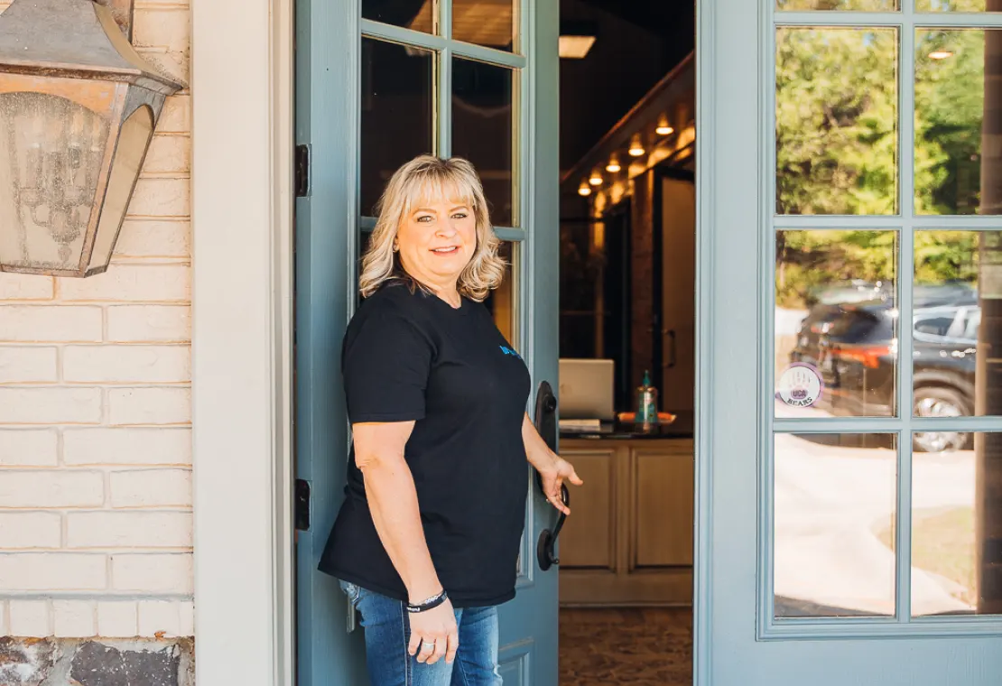 Michelle Watson opening a door
